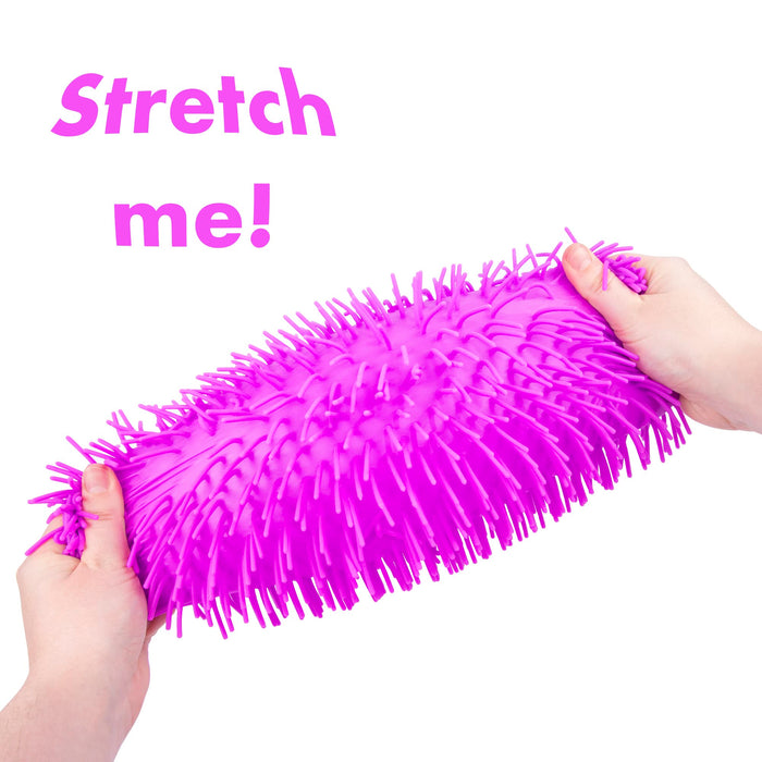 A bright pink textured squeeze ball being stretched by two hands against a white background, with the text 'Stretch me!' in pink at the top left.