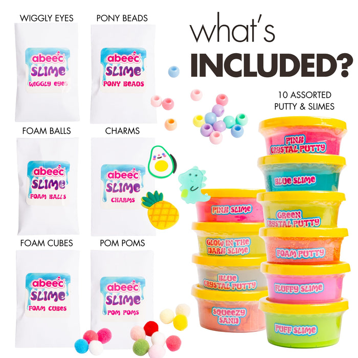 Contents of the abeec slime and putty set laid out, tubs, charms, pom poms, beads and wiggly eyes
