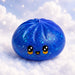 A cute, kawaii-style blue glitter bun toy with a smiling face, resting on white fluffy clouds against a starry sky background.