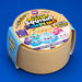 The Viral Mystery Squishy Dumpling Glitter Edition 17cm, shown in its cardboard packaging on a solid blue background.