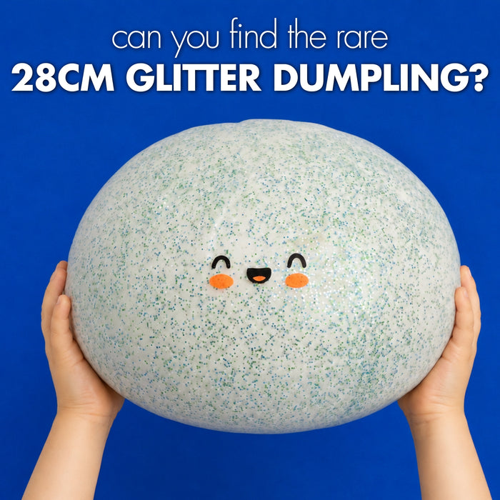A person holds a very large glittery squishy dumpling toy against a bright blue background, with text at the top reading 'can you find the rare 28CM GLITTER DUMPLING?'.
