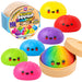 Rainbow edition mystery squishy dumpling toy set, showing multiple colorful dumpling shapes with cute faces alongside the open packaging and lid on a white background.