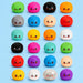 Twenty-four cute kawaii bun-shaped squishy toys arranged in a grid on a light blue background. The buns come in many colors including green, pink, black, orange, gray, blue, beige, red, teal, yellow, purple, and a clear glitter one. Will you receive a special glitter dumpling?