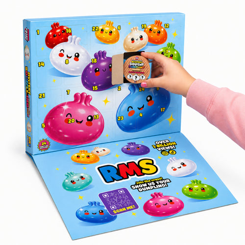 A colourful advent-style gift box with numbered cartoon dumpling faces on a light blue box, shown open with a flat lower panel. A hand in a pink sleeve is holding a small wrapped gift. Contains 24 mini squishy dumplings.