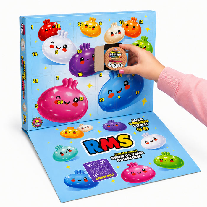 A colourful advent-style gift box with numbered cartoon dumpling faces on a light blue box, shown open with a flat lower panel. A hand in a pink sleeve is holding a small wrapped gift. Contains 24 mini squishy dumplings.