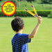 Child holding a yellow and blue boomerang with text asking if it can be thrown to come back, set against a grassy outdoor background.