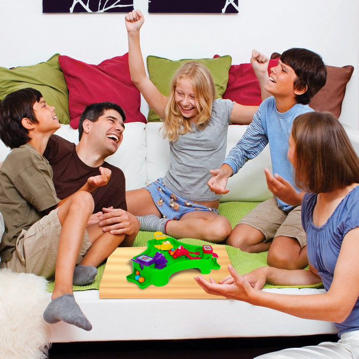 family playing frog feeding frenzy board game